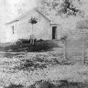 This class posed for a picture in front of the Pleasant Hill School before the turn of century.  One schoolgirl was noted to have received a bible for regular attendance at this Pleasant Hill Sabbath School from S. White.  Other names that this school located on Pleasant Hill Road was called were the Woodhull District School and District School No. 5.  This schoolhouse is now a private residence owned by the Pederson family.